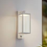 Lucande LED-utomhusvägglampa Ferdinand, vit, sensor, 38 cm