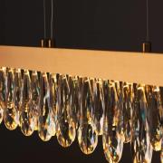 Brilliant LED-hänglampa Celestia, längd 110 cm mässingsfärgad kristall